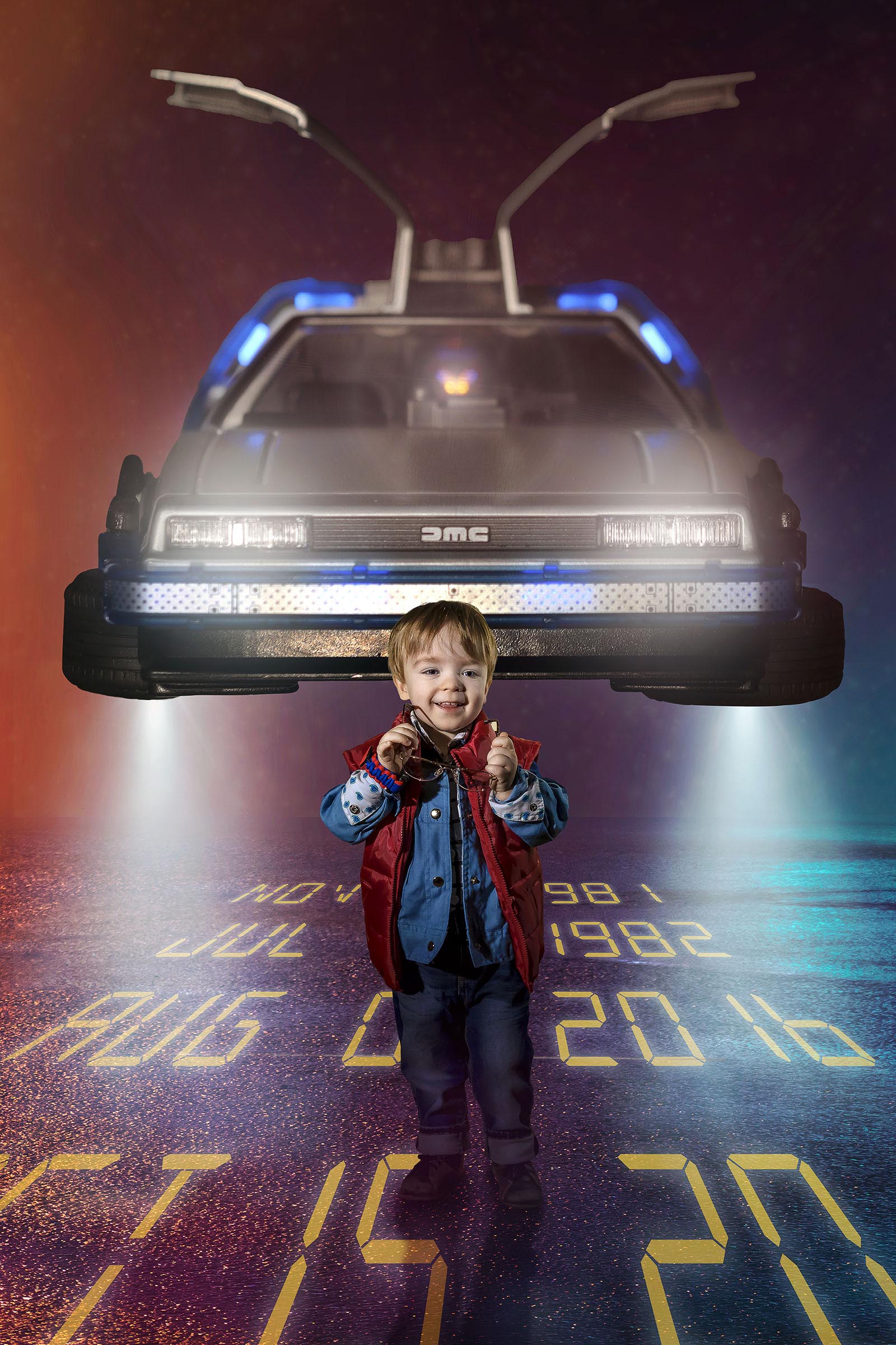 Young boy Marty McFly holding his glasses in his hands with DeLorean flying behind him Back to the Future composite by Vaudreuil-Soulanges and West Island of Montreal photographer Tobi Malette